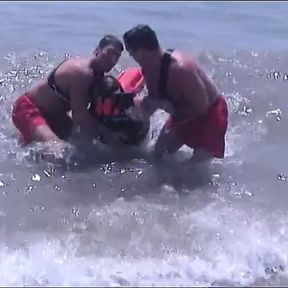 Guy get his thick cock sucked by two lifeguards at same time