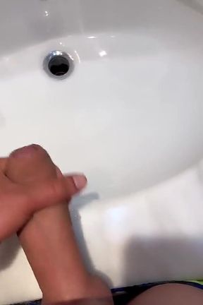 Quick Hotel Bathroom Cumshot Into Sink in Swim Trunks While Friend Is Gone