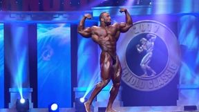 Massive BB Cedric McMillan posing on stage