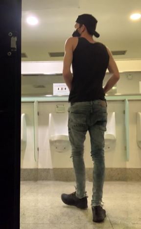 Wank in public toilet