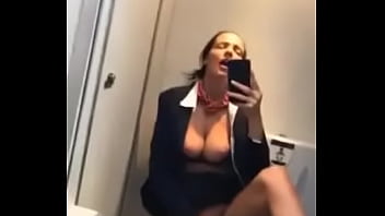 Stewardess masturbates in plane loo.