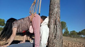 Farting in his face while I crush it between my ass and the tree
