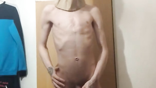 Highly softcore thin teenie puts a paper bag over his head and ripples his assets