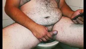 Fat Macho Bear Masturbates While Watching Porn On His Cell Phone