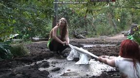 Two amateur babes getting dirty & drowning in mud outdoor