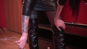 Nipple play  Dominatrix Nika twists the nipples of the slave &mdash;  the grateful slave kisses her legs