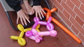 Stomp son's balloons with feet and nails looner