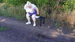 a neighbor in the park undresses and masturbates to orgasm on a bench