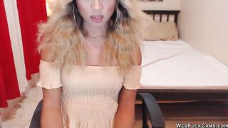 Blonde shemale wanks off in chair in front of webcam