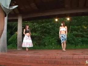 Beautiful mature Japanese woman outdoors and st-down