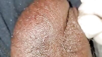 Amateur African bloke plays with his genitals in this close-up footage