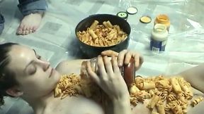 Kinky chick with food fetish covers her body with pasta and sauce