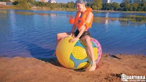 Q890 Stashia pops her vest, floaties and beachball on a lake - 480p