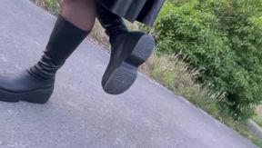 Lexa in boots and suspenders.