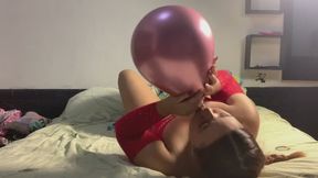 Blowing a sensual balloon and then sitting on it