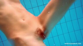 Marusia shows you her unshaved sweet vagina in the pool