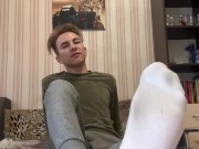 Hot twink shows his black snickers with socks and feet