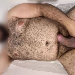 Extended: Uncut hung bear getting hard in the bathtub with slow motion cumshot