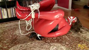 Red rubberdoll in bondage!