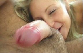 Comely blonde cutie worships her man's dick sucking it hard