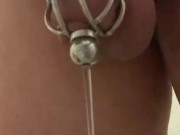 Caged sissy slave pee through urethral plug