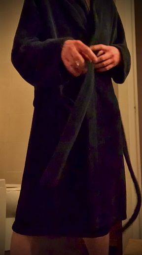 Revealing big hard cock from a dressing gown