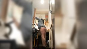 Hot stepmom bends over &mdash;  exposing her juicy booty in the kitchen