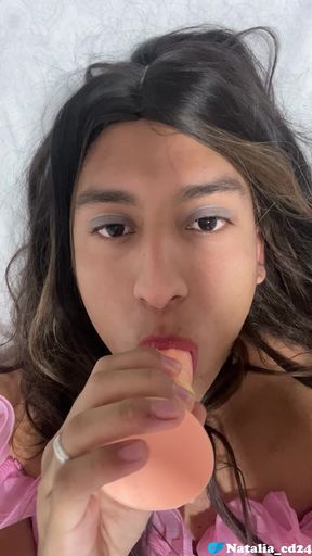 Natalia Valera uses her mouth to put a condom on her dildo and rides it