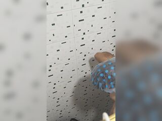 My sister-in-law goes to take a baths and I secretly spy on her; this babe has a large snatch and good breasts.