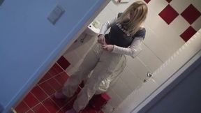 Blonde bitch pissing at home