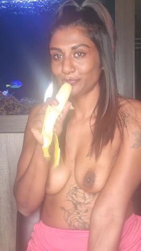 Stunning moment from "Topless desi squeezes her boobs as she sucks and deepthroats on a banana"