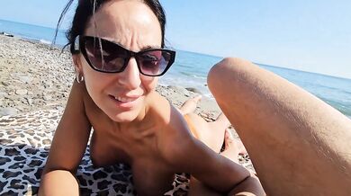 Voyeurs watch Italian MILF choke huge cock on beach
