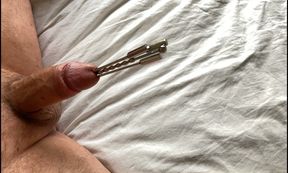 Extreme urethral sounding + cum. Hard oiled cock stuffed full. Multiple sounds and dilators in cock.