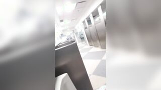 Wanking off and spunking with my trousers down to my ankles at the Chicago airport douche