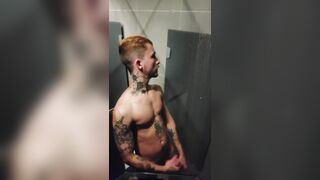 young fellow demonstrating off in the gym bathroom