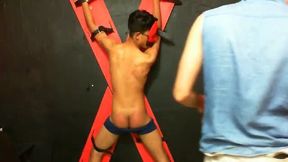 Latin Twink Spanked by Lover While Strapped Onto Red Cross