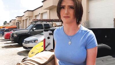 Busty MILF is having sex with car mechanic in a dirty garage
