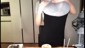 Korean babe fondling her boobs through clothes