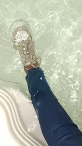 Girlfriend wetlook in jeans and sneakers