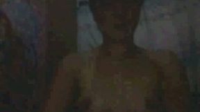 It was dark in her room but I still could see her perky tits on webcam