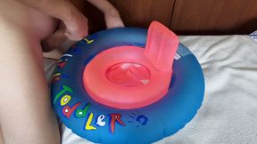 Playing with inflatable swim ring