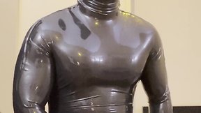 Rubber gimp ejaculating in rubber toe socks