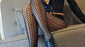 ANIA - Black fishnet stockings on slender legs.