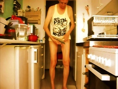 balancing my genitals nude in the kitchen