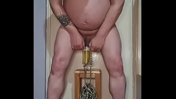 hanging heavy chains from my bullsacks with nipple clamps while taking a pee part 1