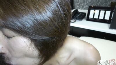 Naughty Asian mom plays with a toy before being fucked