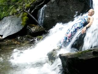 Alexa Cosmic swimming in pretty waterfall wearing colorful combi costume...