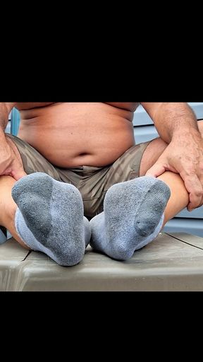 Sock removal and showing my soles after the gym