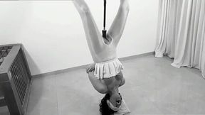 Submissive babe is turned upside down and tied to a fuck machine