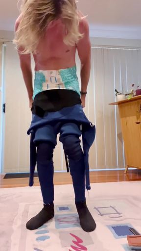 Petplay fun in a wet swimsuit diaper bodysuit